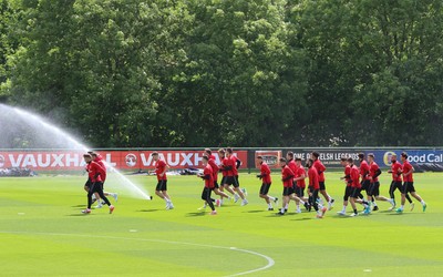 070617 - Wales Football Training Session - The Wales Squad warm up at the start of the training session ahead of the FIFA World Cup Qualifying match against Serbia