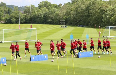 070617 - Wales Football Training Session - The Wales Squad warm up at the start of the training session ahead of the FIFA World Cup Qualifying match against Serbia