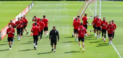 070617 - Wales Football Training Session - The Wales Squad warm up at the start of the training session ahead of the FIFA World Cup Qualifying match against Serbia