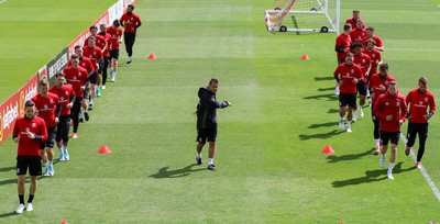 070617 - Wales Football Training Session - The Wales Squad warm up at the start of the training session ahead of the FIFA World Cup Qualifying match against Serbia