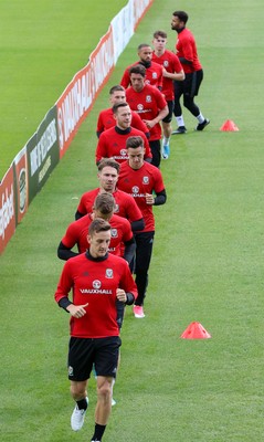 070617 - Wales Football Training Session - The Wales Squad warm up at the start of the training session ahead of the FIFA World Cup Qualifying match against Serbia