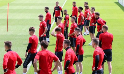 070617 - Wales Football Training Session - The Wales Squad warm up at the start of the training session ahead of the FIFA World Cup Qualifying match against Serbia