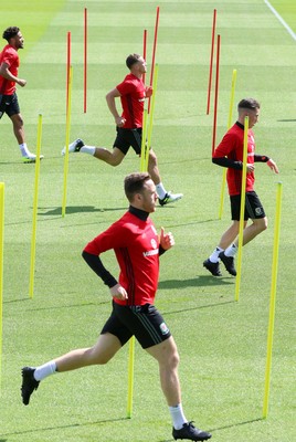 070617 - Wales Football Training Session - The Wales Squad warm up at the start of the training session ahead of the FIFA World Cup Qualifying match against Serbia