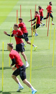 070617 - Wales Football Training Session - The Wales Squad warm up at the start of the training session ahead of the FIFA World Cup Qualifying match against Serbia