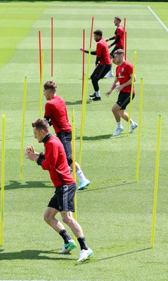 070617 - Wales Football Training Session - The Wales Squad warm up at the start of the training session ahead of the FIFA World Cup Qualifying match against Serbia