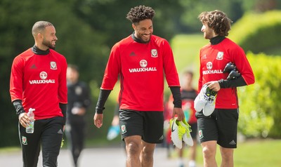 070617 - Wales Football Training Session - Wales' Ashley Richards, Ashley Williams and Joe Allen share a joke during the training session ahead of the FIFA World Cup Qualifying match against Serbia