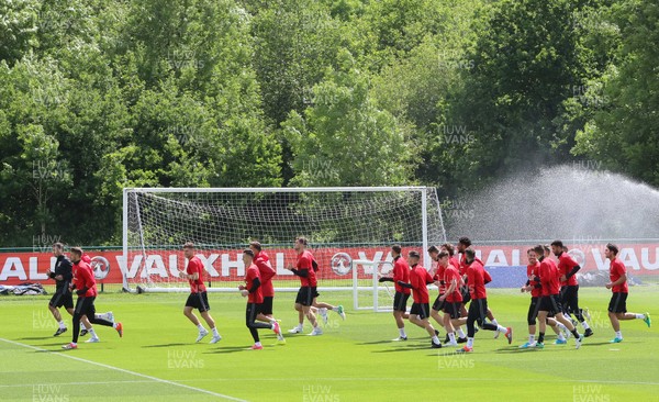 070617 - Wales Football Training Session - The Wales Squad warm up at the start of the training session ahead of the FIFA World Cup Qualifying match against Serbia