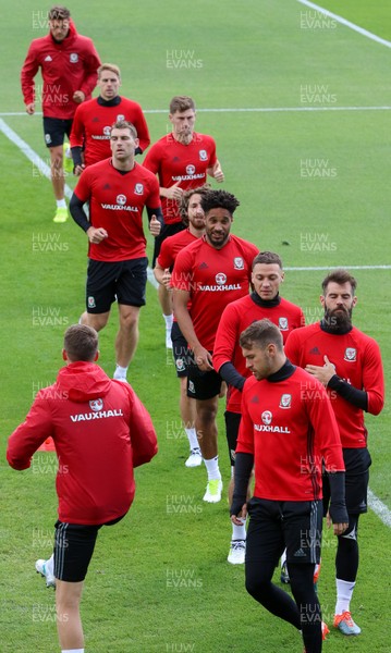 070617 - Wales Football Training Session - The Wales Squad warm up at the start of the training session ahead of the FIFA World Cup Qualifying match against Serbia