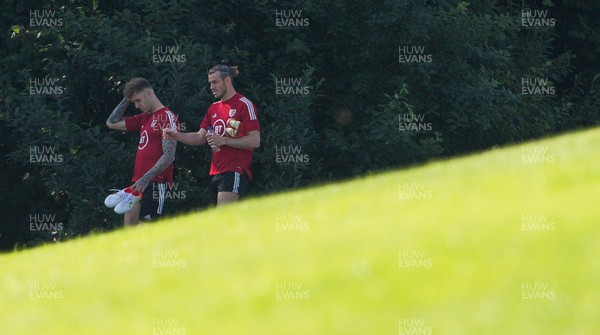 070921 - Wales Football Training Session - Wales' Joe Rodon and Gareth Bale make their way to training ahead of their World Cup Qualifying match against Estonia at the Cardiff City Stadium tomorrow