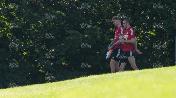 070921 - Wales Football Training Session - Wales' Joe Rodon and Gareth Bale make their way to training ahead of their World Cup Qualifying match against Estonia at the Cardiff City Stadium tomorrow