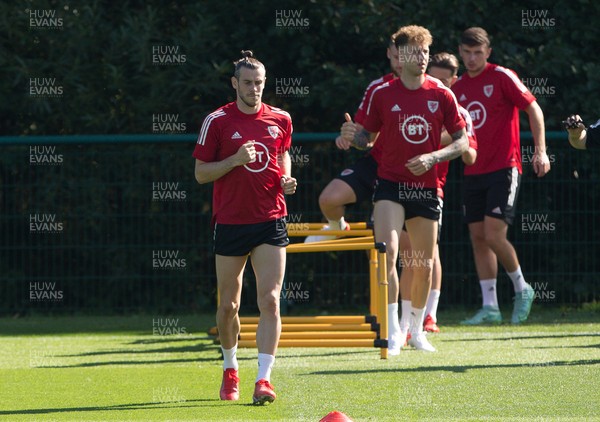 070921 - Wales Football Training Session - Wales' Gareth Bale, left, and Joe Rodon during training session ahead of their World Cup Qualifying match against Estonia at the Cardiff City Stadium tomorrow