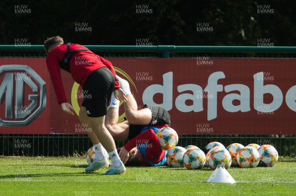 080919 - Wales Football Training session - Wales' Daniel James and Chris Gunter during training session ahead of the International Friendly against Belarus