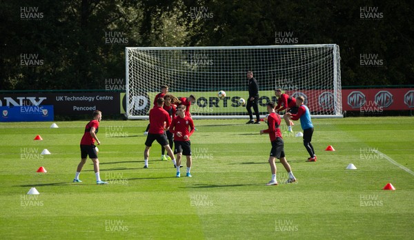 080919 - Wales Football Training session - Wales players warm up during training session ahead of the International Friendly against Belarus