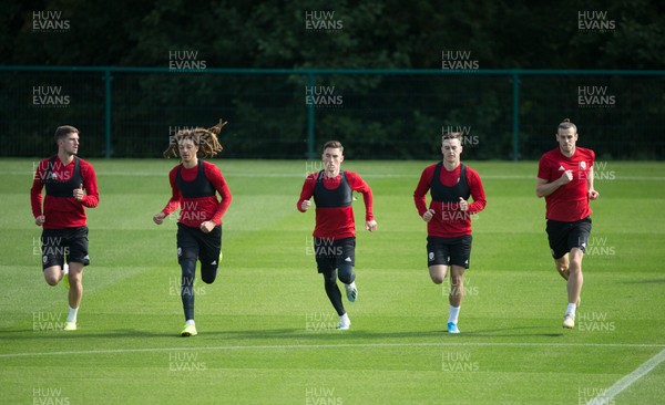 080919 - Wales Football Training session - Wales' Chris Mepham, Ethan Ampadu, Harry Wilson, Tom Lawrence and Gareth Bale warm up during training session ahead of the International Friendly against Belarus