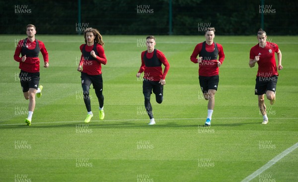 080919 - Wales Football Training session - Wales' Chris Mepham, Ethan Ampadu, Harry Wilson, Tom Lawrence and Gareth Bale warm up during training session ahead of the International Friendly against Belarus