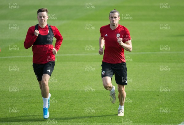 080919 - Wales Football Training session - Wales Tom Lawrence and Gareth Bale warm up during training session ahead of the International Friendly against Belarus