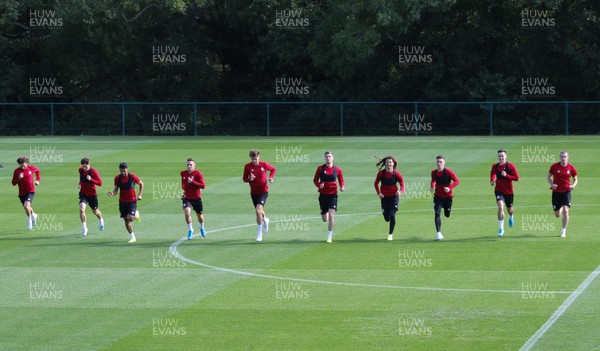 080919 - Wales Football Training session - Wales players warm up during training session ahead of the International Friendly against Belarus