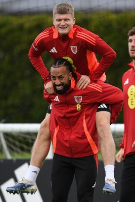 081025 - Wales Football Training - Jordan James and Sorba Thomas of Wales during training ahead of tomorrows friendly match with England