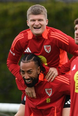 081025 - Wales Football Training - Jordan James and Sorba Thomas of Wales during training ahead of tomorrows friendly match with England