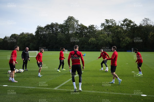 091019 - Wales Football Training session - Wales players warm up during training session ahead of their Euro Qualifying match against Slovakia