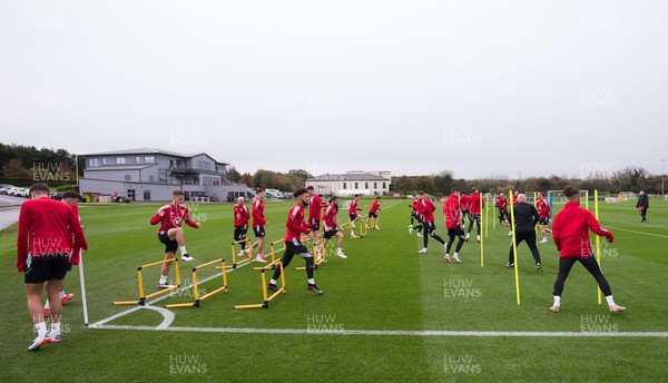 091121 - Wales Football Training - Wales' players warm up during a training session ahead of their World Cup Qualifying matches against Belarus and Belgium