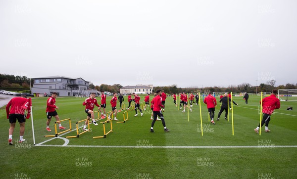 091121 - Wales Football Training - Wales' players warm up during a training session ahead of their World Cup Qualifying matches against Belarus and Belgium