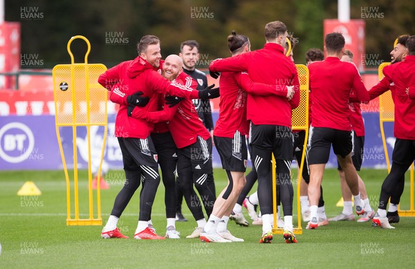 091121 - Wales Football Training - Wales players enjoy a warm up session during a training session ahead of their World Cup Qualifying matches against Belarus and Belgium