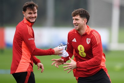 121025 - Wales Football Training - Liam Cullen and Chris Mepham of Wales during a training session ahead of tomorrows World Cup qualifier match against Belgium