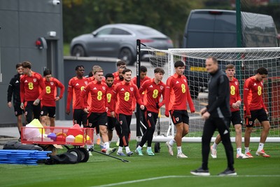 121025 - Wales Football Training - The Wales squad make their way onto the pitch during a training session ahead of tomorrows World Cup qualifier match against Belgium