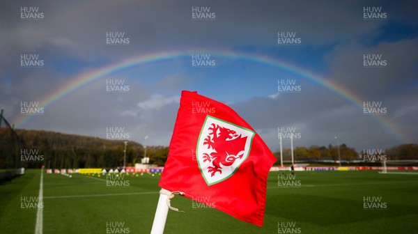121121 - Wales Football Training Session - The Wales FA emblem flies on a corner flag under a rainbow during a training session ahead of the World Cup Qualifying match against Belarus
