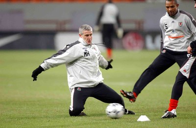 141103 - Wales Football Training - Manager Mark Hughes intercepts pass as Gary Speed and Danny Gabbidon train