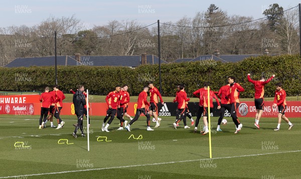 190325  Wales Men Football Training - The Wales squad warm up during a Wales training session ahead of the 2026 World Cup Qualifiers with Kazakhstan and North Macedonia