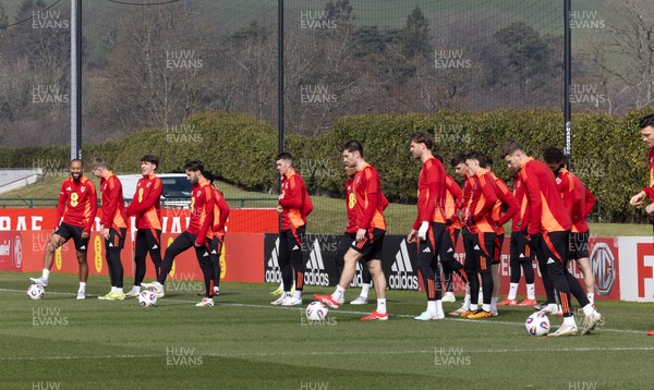 190325  Wales Men Football Training - The Wales squad warm up during a Wales training session ahead of the 2026 World Cup Qualifiers with Kazakhstan and North Macedonia