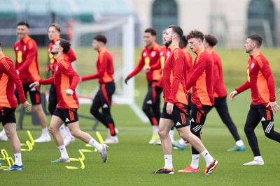 200324 - Wales Football Training Session - Wales players warm up during training session ahead of Wales’  Euro 2024 qualifying play-off semi-final against Finland