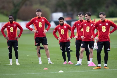 200324 - Wales Football Training Session - Wales players warm up during training session ahead of Wales’  Euro 2024 qualifying play-off semi-final against Finland