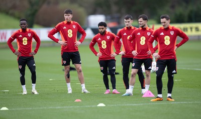 200324 - Wales Football Training Session - Wales players warm up during training session ahead of Wales’  Euro 2024 qualifying play-off semi-final against Finland