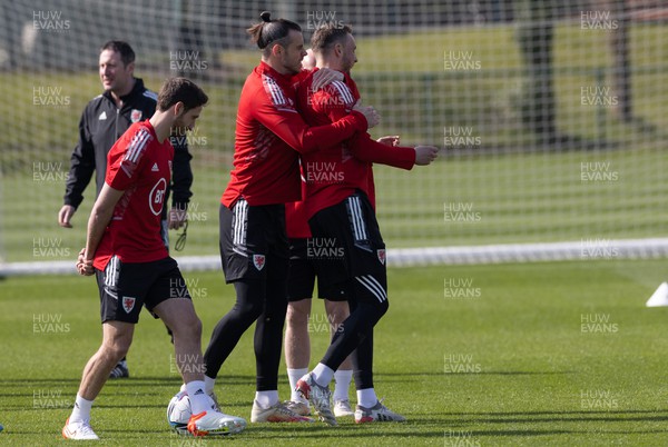 230322 Wales Football Training - Gareth Bale and Chris Gunter lark around during a Wales football training session ahead of the World Cup Qualifier play off semi final match against Austria