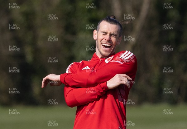 230322 Wales Football Training - Gareth Bale enjoys the joke during a Wales football training session ahead of the World Cup Qualifier play off semi final match against Austria