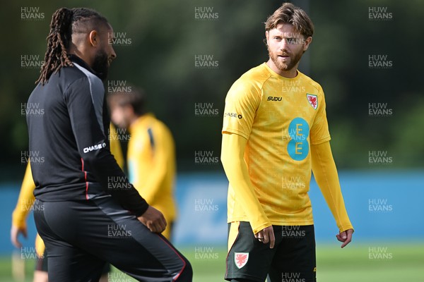 230926 - Wales Football Training - Wales coach, Ashley Williams and Wes Burns during training ahead of their upcoming Nations League match against Portugal