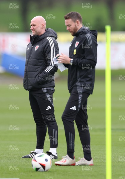 250324 - Wales Football Training Session -  Wales manager Rob Page and coach Chris Gunter during training session ahead of their Euro 2024 qualifying play-off final against Poland