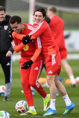 250326 - Wales Football Training - Brennan Johnson and Harry Wilson of Wales during training ahead of their World Cup play-off match against Bosnia-Herzegovina