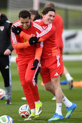 250326 - Wales Football Training - Brennan Johnson and Harry Wilson of Wales during training ahead of their World Cup play-off match against Bosnia-Herzegovina