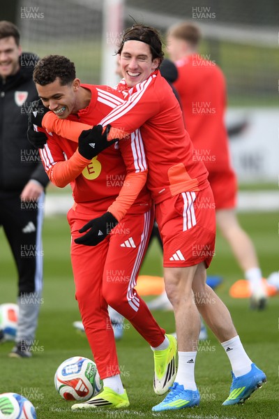 250326 - Wales Football Training - Brennan Johnson and Harry Wilson of Wales during training ahead of their World Cup play-off match against Bosnia-Herzegovina