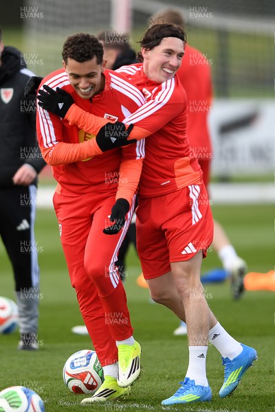 250326 - Wales Football Training - Brennan Johnson and Harry Wilson of Wales during training ahead of their World Cup play-off match against Bosnia-Herzegovina