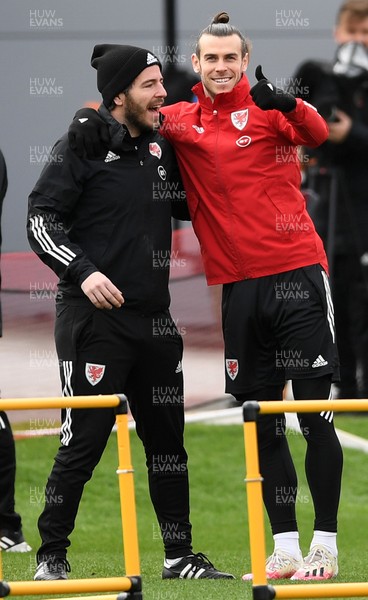 290321 - Wales Football Training - Gareth Bale with a member of FAW staff during training
