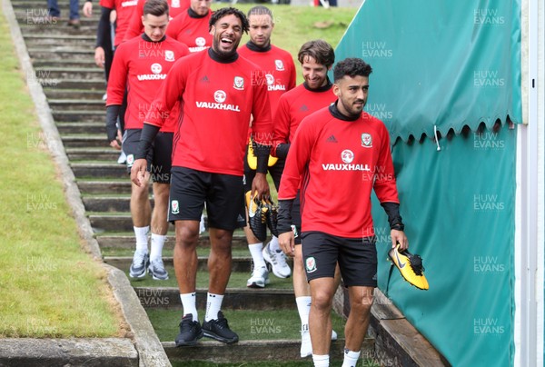 290817 - Wales Football Training - Ashley Williams shares a joke with Joe Allen as they arrive at training