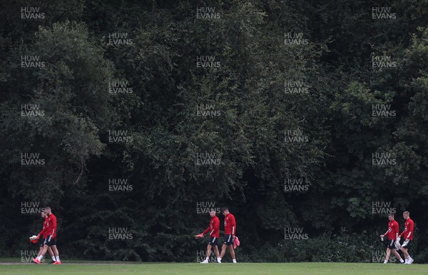 310821 - Wales Football Training - Wales players make their way to a training session ahead of their friendly against Finland and World Cup qualifying matches against Belarus and Estonia