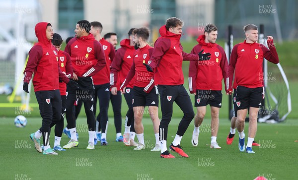 131123 - Wales Football Training Session - Wales players warm up during a training session ahead of the Euro 2024 Qualifying matches against Armenia and Turkey