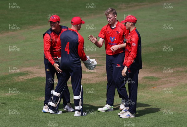 310722 - Wales National County v Glamorgan - One Day Tour Match - Ben Morris with team mates after Colin Ingram of Glamorgan is caught by Alex Horton