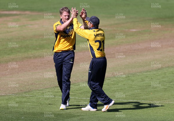 310722 - Wales National County v Glamorgan - One Day Tour Match - Timm Van Der Gugten of Glamorgan celebrates taking the wicket of Alex Horton who was caught by Sam Northeast